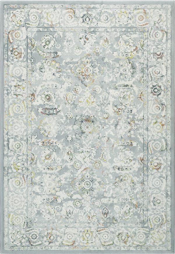 : Faded Traditional patterned rug predominantly grey with rust and blue tones