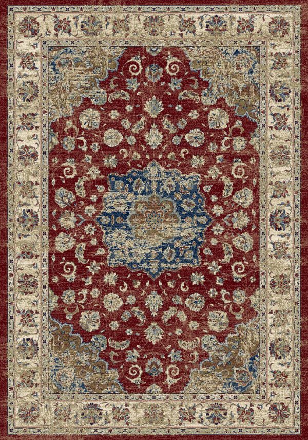 Traditional patterned rug with a border. Blues, creams rusts on a red background