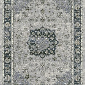 Traditional patterned rug with a border. Blues, silver on a grey background