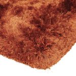 Heavy weight shaggy rug in a strong orange/rust colour