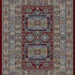 Heavily patterned traditional rug with blues creams and golds on a red background