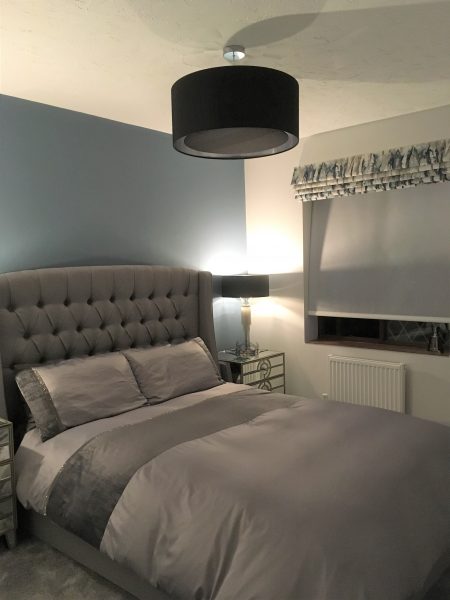 Grey Bedroom with Blue Wall